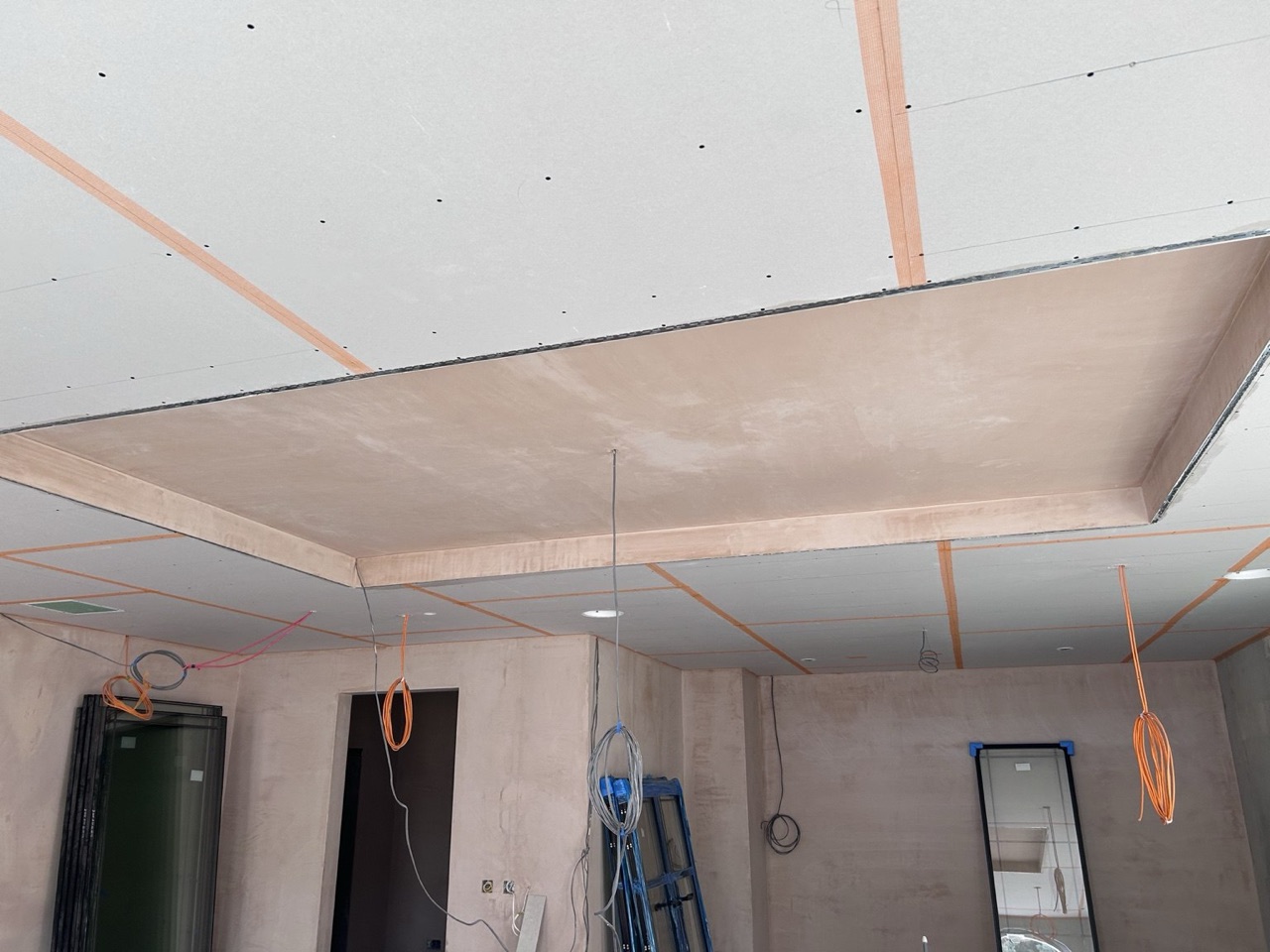 Plasterboard ceiling boarding in progress